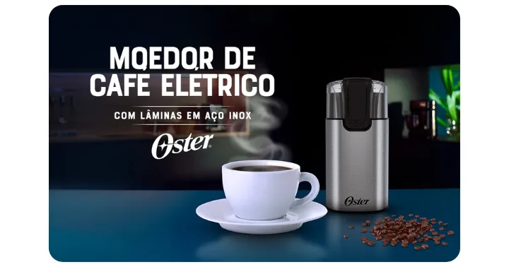 Moedor de Café Elétrico Inox - Oster na bancada com uma xícara de café e grãos.